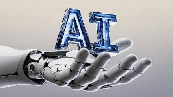 A robotic hand holding large 3D letters that spell AI, symbolizing the integration of artificial intelligence skills in the modern tech career landscape.